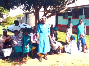 Patients resting under a mango tree. 